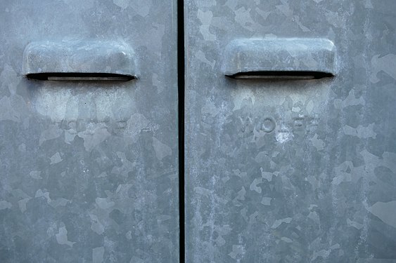 Handles on a shared garbage shack from a small apartmenthouse in Munich