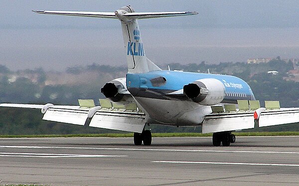 KLM Fokker 70, showing position of flap and liftdumper flight controls. The liftdumpers are the lifted cream-coloured panels on the wing upper surface