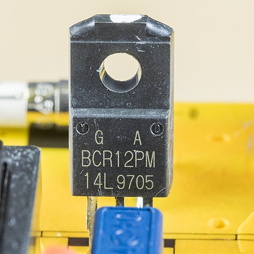 A small plastic-cased TRIAC device mounted on a printed circuit board