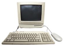 A 1990s Macintosh LC II system. Radiohead used the synthesised voice of "Fred", included with older Macintosh software, to recite the lyrics of "Fitter Happier". Lcii-system.jpg