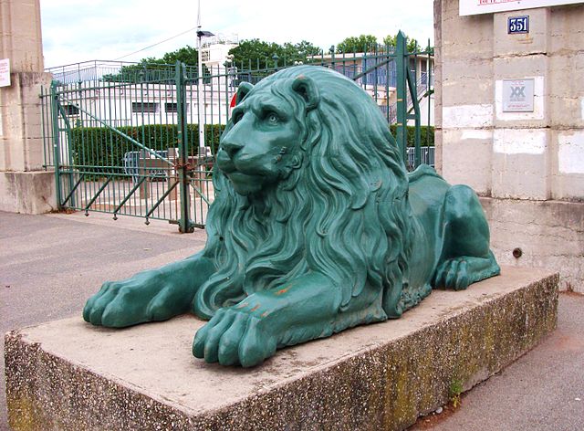 One of the two lions guarding the main entrance to the Stade Gerland.