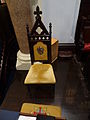 A chair with the name "Luke" embroidered on its upholstery on the west side of the chancel of Saint Anne's Episcopal Church. Located at 8 Kirk Street Lowell, Massachusetts.