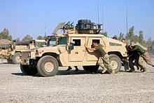 U.S. Marines pushing an M1114 HMMWV during a 'Humvee Push' competition, in 2016. M1114CLB5HMMWVPUSHOIF.JPG