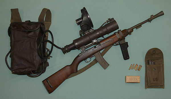 USMC M3 Sniperscope assembled on a M3 Carbine. Introduced during the Korean War, it was an early active infrared night vision equipment powered by a l