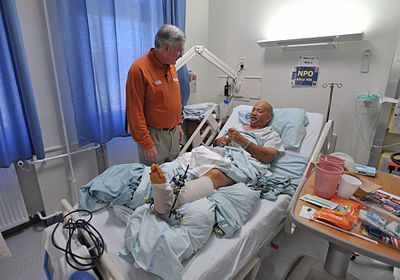 Mack Brown visiting a US military hospital in Germany