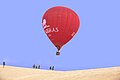 Hot Air Balloon over white sand dunes