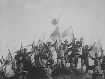Imperial Japanese Army soldiers give a banzai ...