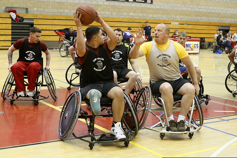 File:Retired U.S. Marine Corps Lance Cpl. Nicholas Green, with the East team, keeps the ball from retired Staff Sgt. Jason Lawson during preliminary game play in the wheelchair basketball competition at the 2012 120218-M-VW165-140.jpg