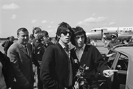 The Rolling Stones members Keith Richards, Bill Wyman, and Charlie Watts at Turku Airport in Turku, Finland, on 25 June 1965.