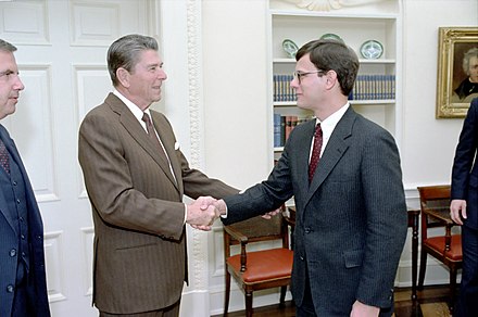 President Ronald Reagan greeting Roberts in the Oval Office while Roberts was serving as an associate White House Counsel (1983)