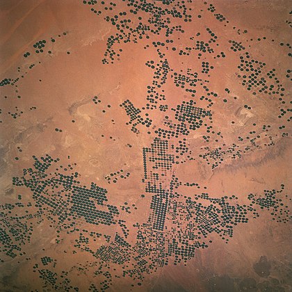 Pivot irrigation in Saudi Arabia, April 1997. Saudi Arabia is suffering from a major depletion of the water in its underground aquifers.[72]
