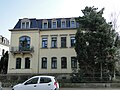 Tenement house with enclosure in open development