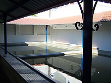 Washhouse in Cabecao, Portugal, today. Note the two basins and inclined stone lip. Tanque das Lavandeiras - comunitario II.jpg