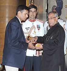 President Pranab Mukherjee presenting the Padma Bhushan to Dravid, c. 2013.