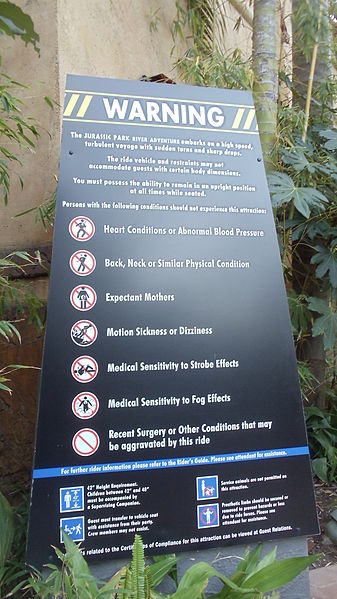 Warning sign at the entrance of Jurassic Park River Adventure at Islands of Adventure.