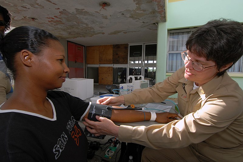 File:US Navy 070917-N-8704K-029 Cmdr. Sally Jarvis, attached to Military Sealift Command hospital ship USNS Comfort (T-AH 20), checks the vital signs of a patient at the Arima Health Facility.jpg