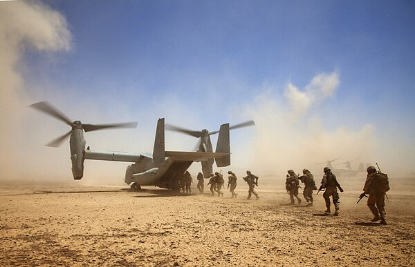 Georgian soldiers of 33rd Battalion and US Marines board a MV-22B Osprey during the Georgian lead operation Northern Lion II, 2013