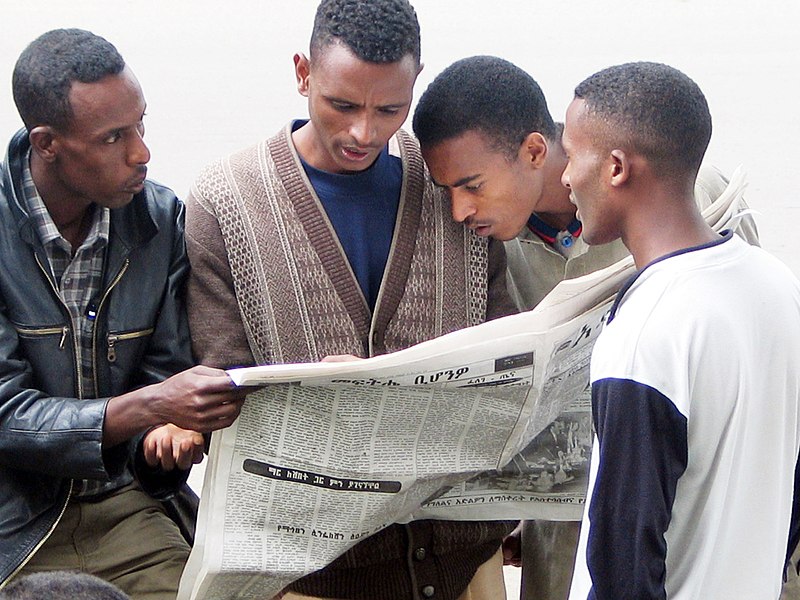 File:2004 reading newspaper Addis Ababa Ethiopia 91389965.jpg