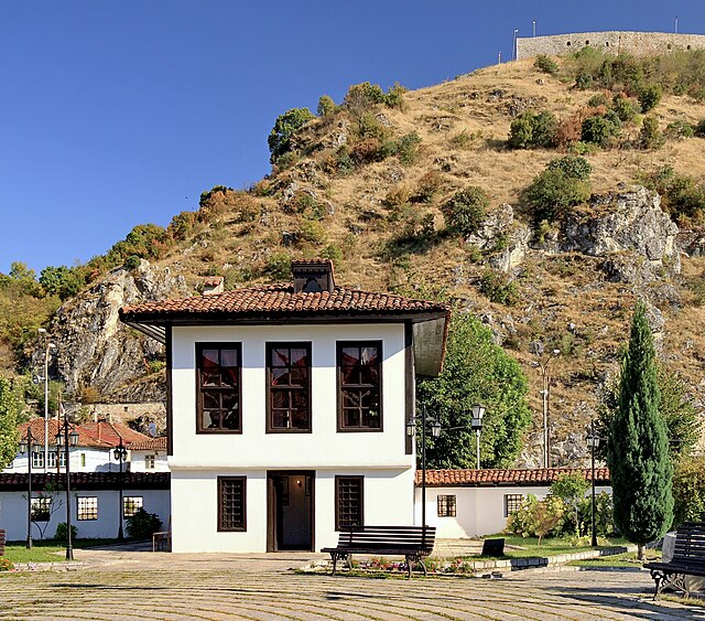 The Monumental Complex of the Albanian League of Prizren from inside the courtyard, and up in the background is the Prizren Fortress