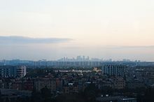 Cityscape of Jianggan District, taken near the airport. Heights of the buildings vary with the distance to the airport due to the height-restriction policy. 201611 City Landscape of Hangzhou.jpg