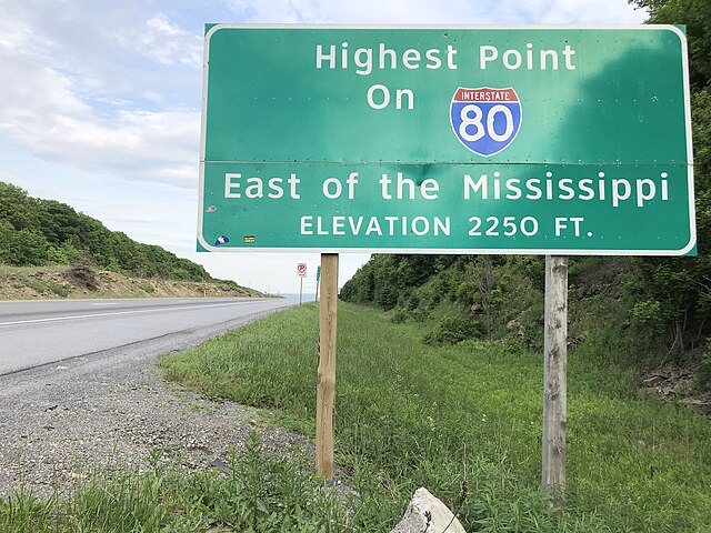 Sign noting the highest point on I-80 east of the Mississippi River located in Clearfield County