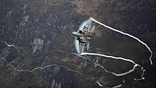 Cogs maneuvering a 336th F-15E through the Mach Loop 336 F-15E Mach Loop.jpg