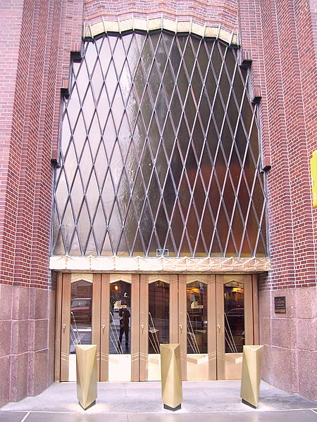 Main entrance, showing the bronze doors beneath the bronze lintel. At the top is a glazed window with diagonal muntins