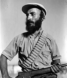 Yemenite Haganah member on guard duty at moshav Elyashiv A YEMENITE "HAGANA" MEMBER ON GUARD DUTY AT MOSHAV ELYASHIV. SHvmr tymny SHl Argvn hhgnh bmvSHb AlySHyb.D403-126.jpg