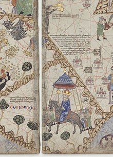 Land of "Gog i Magog", its king mounted on a horse, followed by a procession (lower half); Alexander's Gate, showing Alexander, Antichrist, and mechanical trumpeters (upper left).
--Catalan Atlas (1375), Paris, Bibliotheque Nationale. Abraham Cresques Atlas de cartes-GogiMagog-crop.jpg