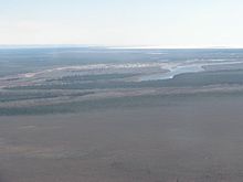 Attawapiskat, situated between the Attawapiskat River and James Bay Attawapiskat Town between Attawapiskat River.jpg