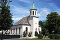 Evangelisch-lutherische Johanneskirche an der Schützenstraße in Bad Tölz, Landkreis Bad Tölz-Wolfratshausen, Regierungsbezirk Oberbayern, Bayern. Erbaut vom Münchner Architekten Martin Wintergerst, Einweihung am 24. Juni 1880. Erweiterungen und Umbauten in den Jahren 1896, 1926 und 1970.