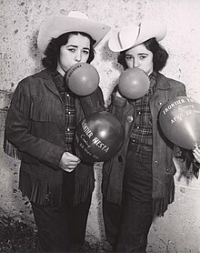 Balloons Depicting Frontier Fiesta April 22-26 in the 1950s Blowing Up Balloons.jpg