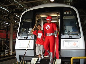 Captain SMRT demonstrating the use of a refurbished C151's emergency detrainment ramp. CaptainSMRTC151New.JPG