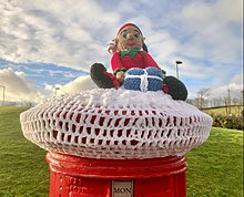 A crocheted Christmas post box topper at Inverkip, Scotland, December 2020. Christmas Crochet figure, Inverkip pillarbox 2.jpg