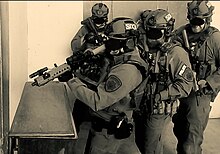 Agents Training in a Tactical Shoothouse Conducting Tactical Training.jpg