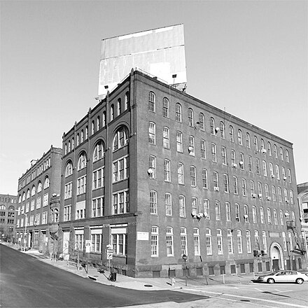 The Copycat Building shown from the corner of East Oliver Street and Guilford Ave.