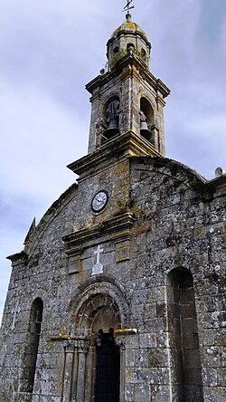 Deatails of the facade of the church of San Salvador de Escuadro and campanile.