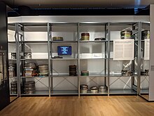 Simulation of a film archive: the shelves have been left almost empty to help visitors better visualize the gap between the number of surviving films and the number of films actually made. Filmmuseum Berlin - Frame By Frame - Archive Simulation.jpg