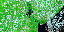 The Pungwe River flooding as seen from NASA MODIS satellite in 2010.