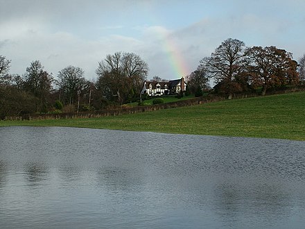 The Lynches with the River Clun in flood below. Floods and rainbow - geograph.org.uk - 1596651.jpg