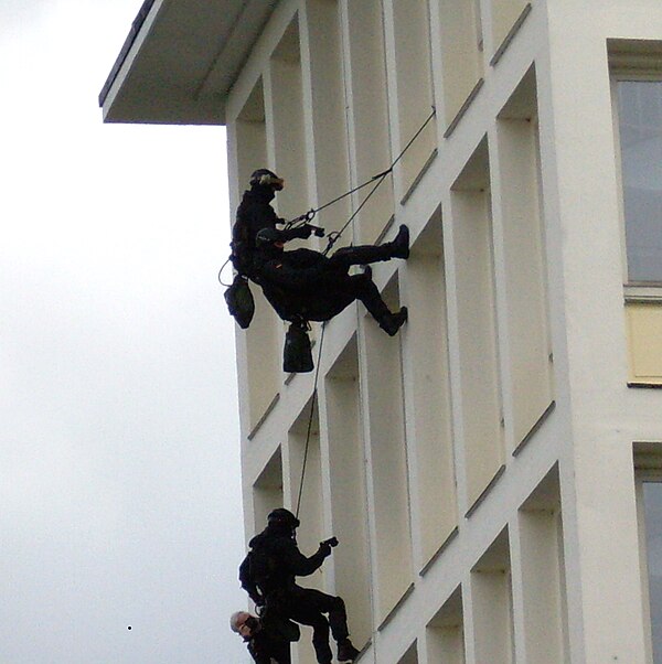 GSG 9 operators rappel on a building of the German Bundeskriminalamt.