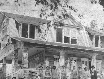 Elwin Hemingway pictured with craftsmen during Hemingway House construction. Hemingway House Construction.jpg