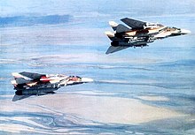 Iranian F-14 Tomcats armed with multiple types of air-to-air missiles, including AIM-54 Phoenixes, in 1986. Irani F-14 Tomcats carrying AIM-54 Phoenixs.jpg