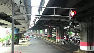 Elevated toll road on Jalan Ahmad Yani by pass, Jakarta, Indonesia. The elevated road used the Sosrobahu construction technique that rotates the beam-supporting bar on each pylon. Jalan Layang Ahmad Yani Pramuka Pemuda Jakarta.jpg