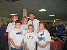 Bayh posing with a group of children in New Hampshire while making an appearance on behalf of John Lynch's gubernatorial campaign Kids for Democracy (NH) w- Evan Bayh (251934660).jpg