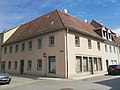 Residential house with shop in closed development and corner location