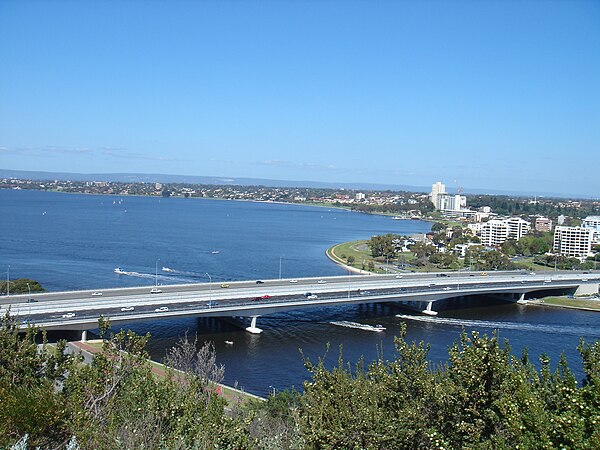 The duplicate bridge seen here in the foreground, with the darker road surface.