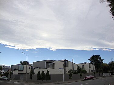 The Nor'west arch, as visible from Christchurch, shows a blue belt of clear sky to the west from which high white cloud streams. Nor'west arch2.JPG