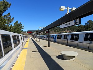 Old and new BART trains at Orinda station, March 2018.JPG