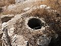 Old cistern with secure stone cover